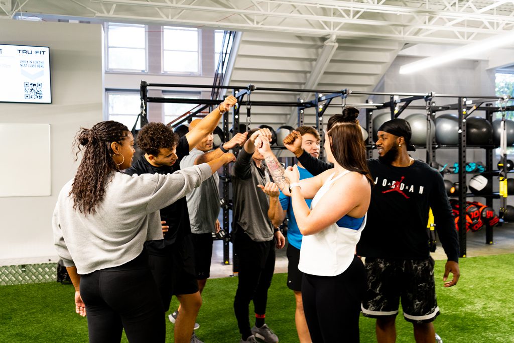Group of TruFit members huddled together at a Group Training session